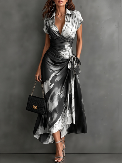 Rosalie | Vestido midi cruzado con estampado abstracto, escote en V, manga corta, cinturón y bajo asimétrico con volante